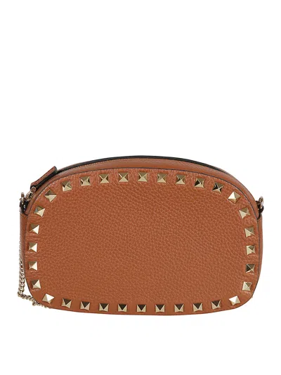 Valentino Garavani Studded Leather Crossbody Bag With Chain Strap In Brown