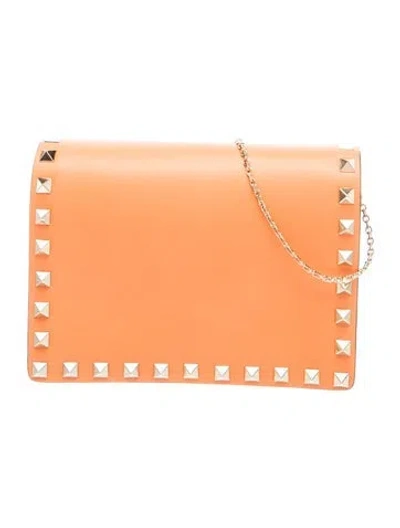 Pre-owned Valentino Garavani Rockstud Clutch In Orange