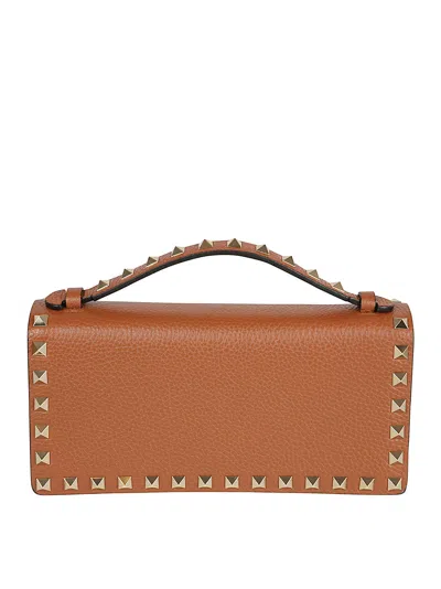 Valentino Garavani Rockstud-embellished Clutch Bag In Brown
