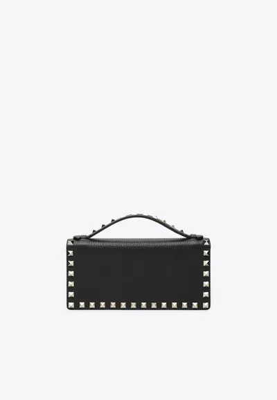 Valentino Garavani Rockstud Grained Leather Clutch Bag In Black