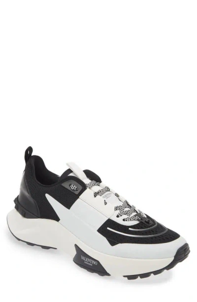 Valentino Garavani Rockstud Knit Trainer In Nero-bianco