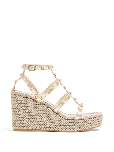 Valentino Garavani Valentino Rockstud Caged 95 Leather Ankle Strap Wedge Sandal In Gold