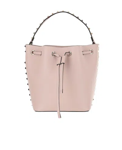 Valentino Garavani Leather Bucket Bag Featuring Rockstud Accents In Pink