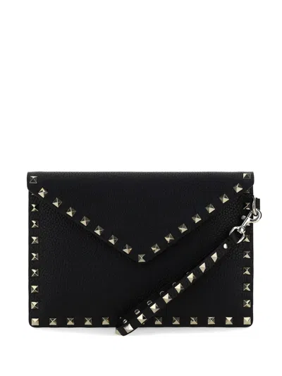 Valentino Garavani Rockstud Grained Calfskin Leather Pouch With Studs And Handle In Black