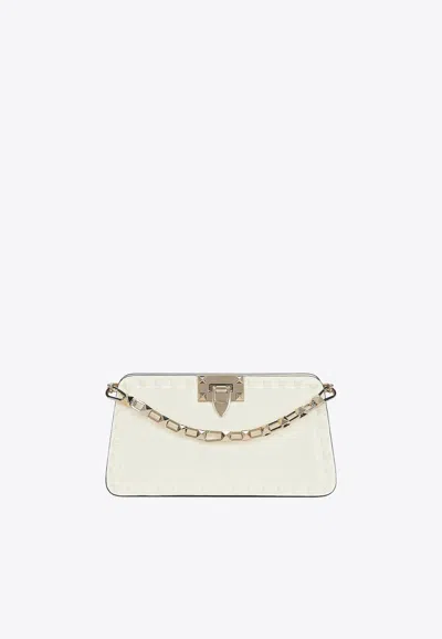 Valentino Garavani Rockstud Leather Clutch Bag In Ivory