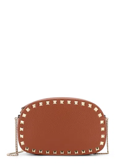 Valentino Garavani Studded Leather Crossbody Bag With Chain Strap In Brown