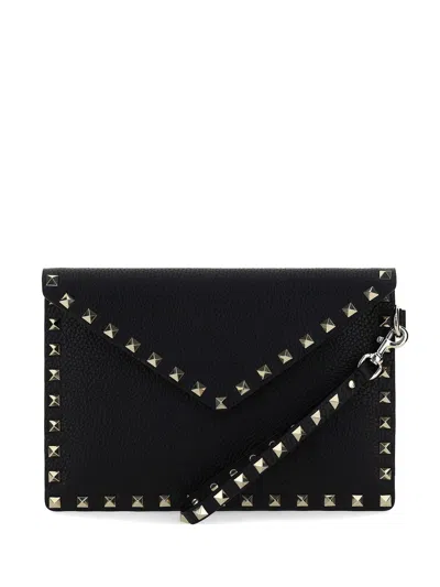 Valentino Garavani Valentino Rockstud Medium Flat Pouch Handbag In Nero