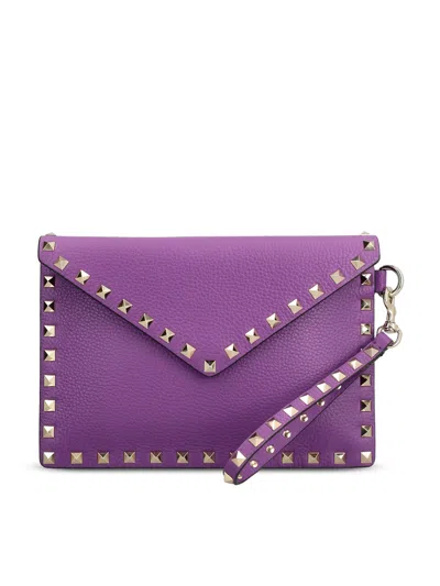 Valentino Garavani Valentino Rockstud Medium Flat Pouch Handbag In Viola