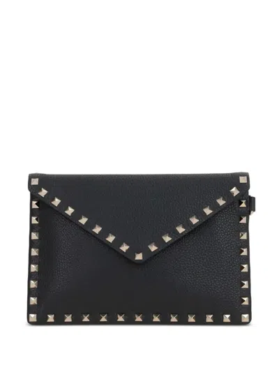 Valentino Garavani Valentino Rockstud Medium Flat Pouch In Black