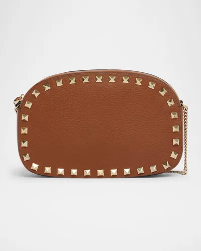Valentino Garavani Rockstud Mini Leather Crossbody Bag In Brown