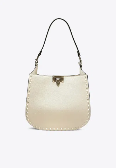 Valentino Garavani Rockstud Strapped Shoulder Bag In Ivory