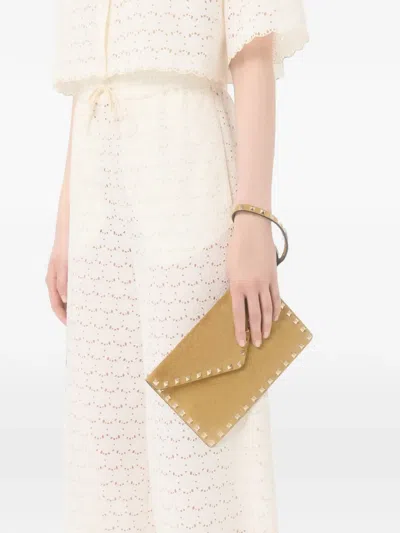 Valentino Garavani Rockstud Suede Clutch Bag In Red
