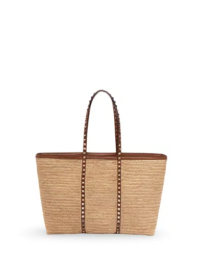 Valentino Garavani Rockstud Leather-trimmed Raffia Tote In Nude