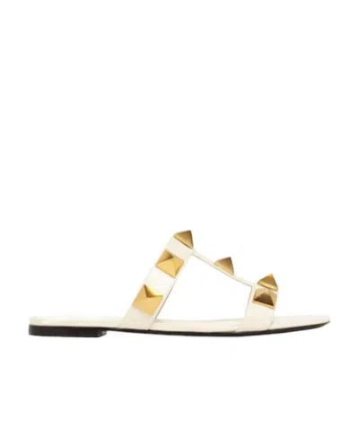 Valentino Garavani Roman Stud Flat Sandals With Signature Pyramid Studs In White