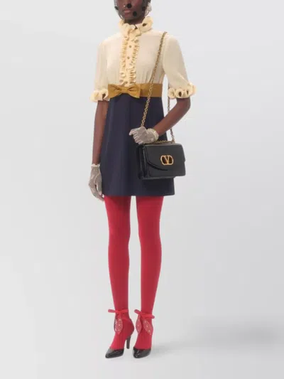 VALENTINO SHORT DRESS WITH BOW ACCENT AND HIGH NECKLINE