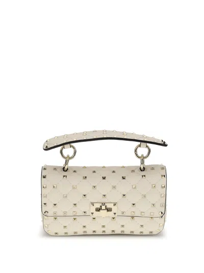 Valentino Garavani Small Leather Rockstud Spike Handbag In Beige
