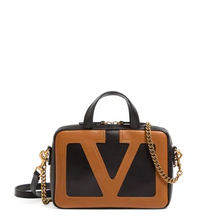 Valentino Garavani Small Leather Viva Superstar Duffle Bag In Black/brown