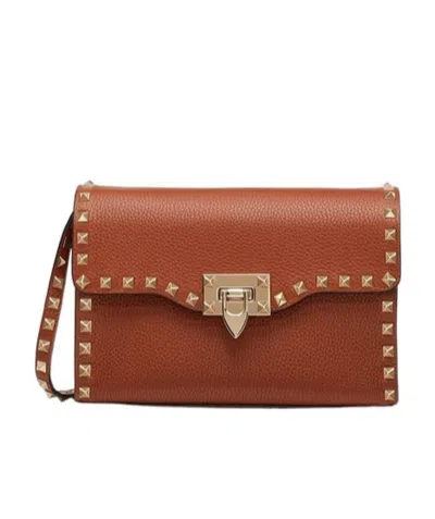Valentino Garavani Small Rockstud Crossbody Bag In Brown