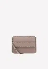 Valentino Small Rockstud Grained Leather Crossbody Bag In Blush
