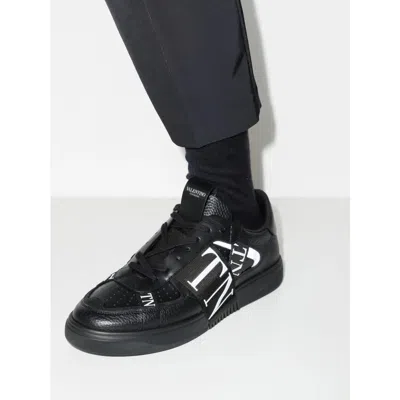 Valentino Garavani High Top Leather Sneakers With Rubber-effect Logo In Black