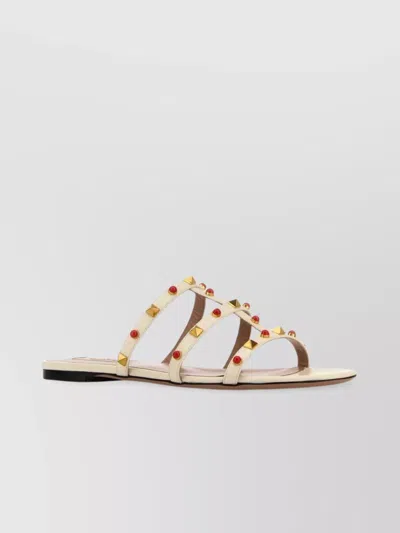 Valentino Garavani Studded Straps Open Toe Flat Sole Sandals In Gold