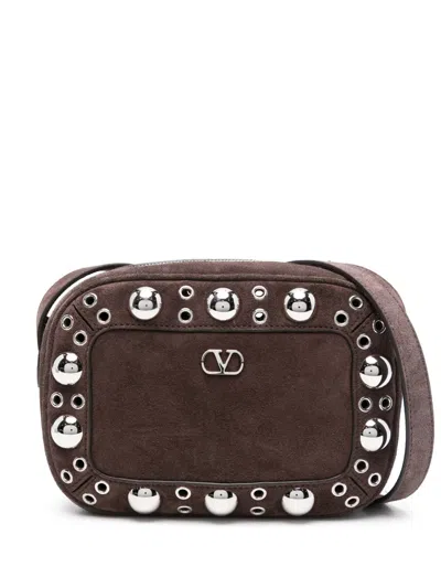 Valentino Garavani Dome-shaped Crossbody Bag With Metallic Eyelets And Adjustable Strap In Brown