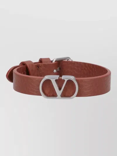 Valentino Garavani Textured Leather Bracelet Featuring Signature Detail In Brown