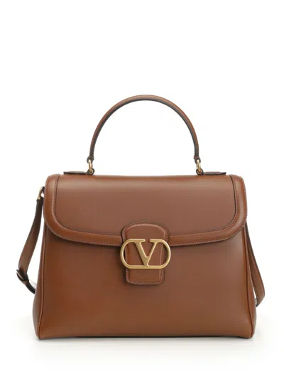 Valentino Garavani Top Handle Bag | 9to5 | Vit.nappato Lucido/a.brass Logo Handbags Brown