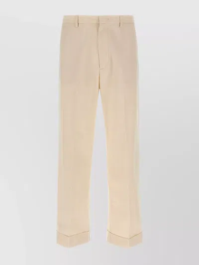 VALENTINO TURN-UP TROUSERS WITH BACK POCKETS AND CUFFED HEM