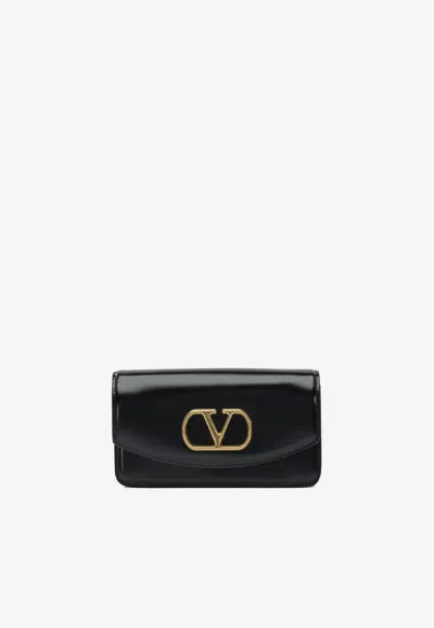 Valentino Garavani Vain Shiny Leather Clutch Bag In Black