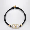 Valentino Garavani Vlogo Signature Bracelet In Black And Gold Women