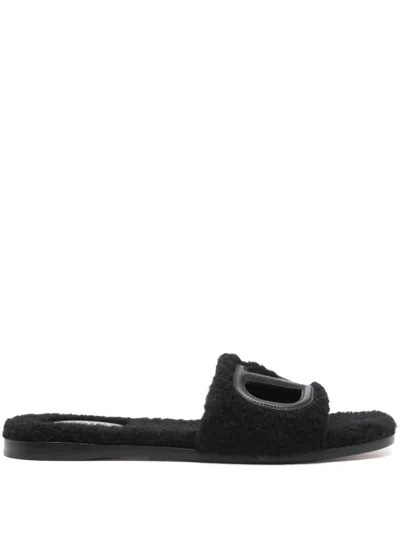 Valentino Garavani Vlogo Cut-out Faux-shearling Slides In Black