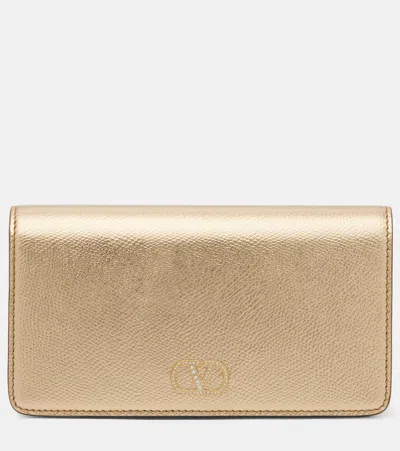 Valentino Garavani Vlogo Mini Metallic Leather Clutch In Gold