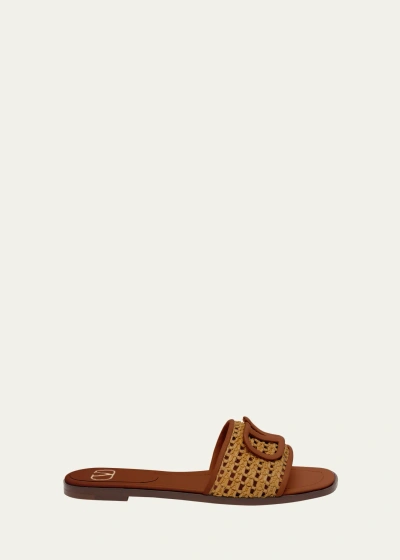 Valentino Garavani Vlogo Raffia Flat Slide Sandals In N30 Tabacco Selle