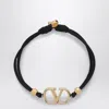 Valentino Garavani Vlogo Signature Bracelet In Black And Gold Women In Black