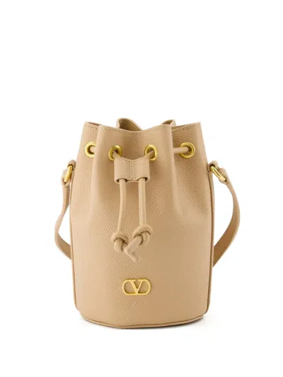 Valentino Garavani Vlogo Signature Drawstring Bucket Bag In Neutral