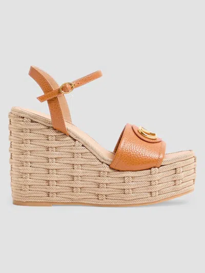 Valentino Garavani Women's Vlogo Signature 120mm Wedge Sandals In Grainy Calfskin In Brown