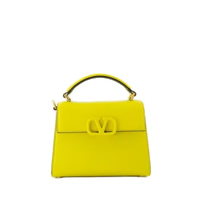 Valentino Garavani Valentinoi Locò Embroidered Small Shoulder Bag In Yellow