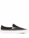 Vans Ua Slip-on Canvas Sneakers In Black
