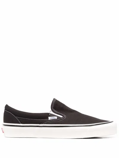 Vans Ua Slip-on Canvas Sneakers In Black