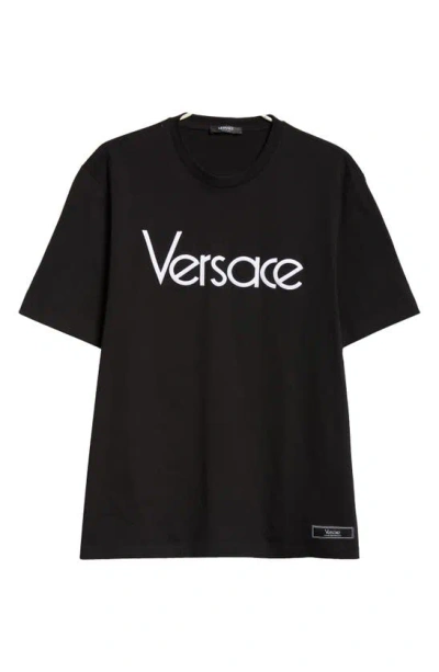 Versace Short-sleeve Cotton T-shirt With Bold Logo Print In Black