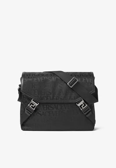 Versace All-over Logo Jacquard Messenger Bag In Black