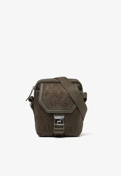 Versace All-over Logo Jacquard Messenger Bag In Brown