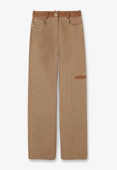 VERSACE ALL-OVER LOGO PANTS