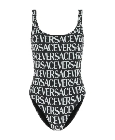 Versace All-over Logo Print One-piece In Green