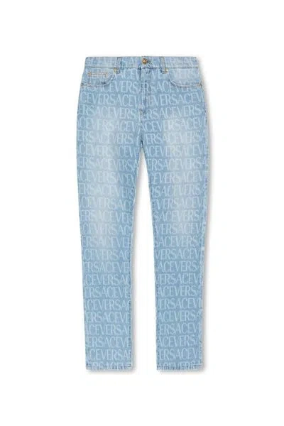 Versace All Over Logo Straight-leg Jeans In Denim
