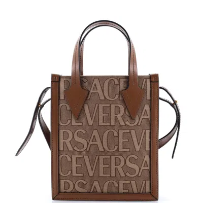 Versace Allover Logo Convertible Tote Printed Canvas Mini In Brown