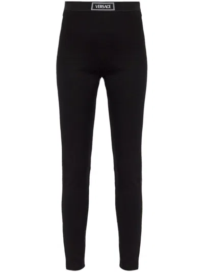 Versace Ankle-length Trousers With Elasticated Logo Waistband In Black