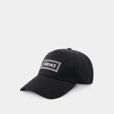 Versace Logo-embroidered Cotton Cap In Black