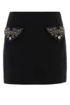 Versace Chic Fitted Mini Skirt With Embellished Pockets In Black